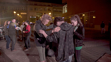 NLM member praying for people after NLM concert in Czech Republic