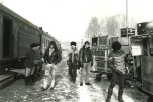 The band unloads their equipment from the train in Mongolia